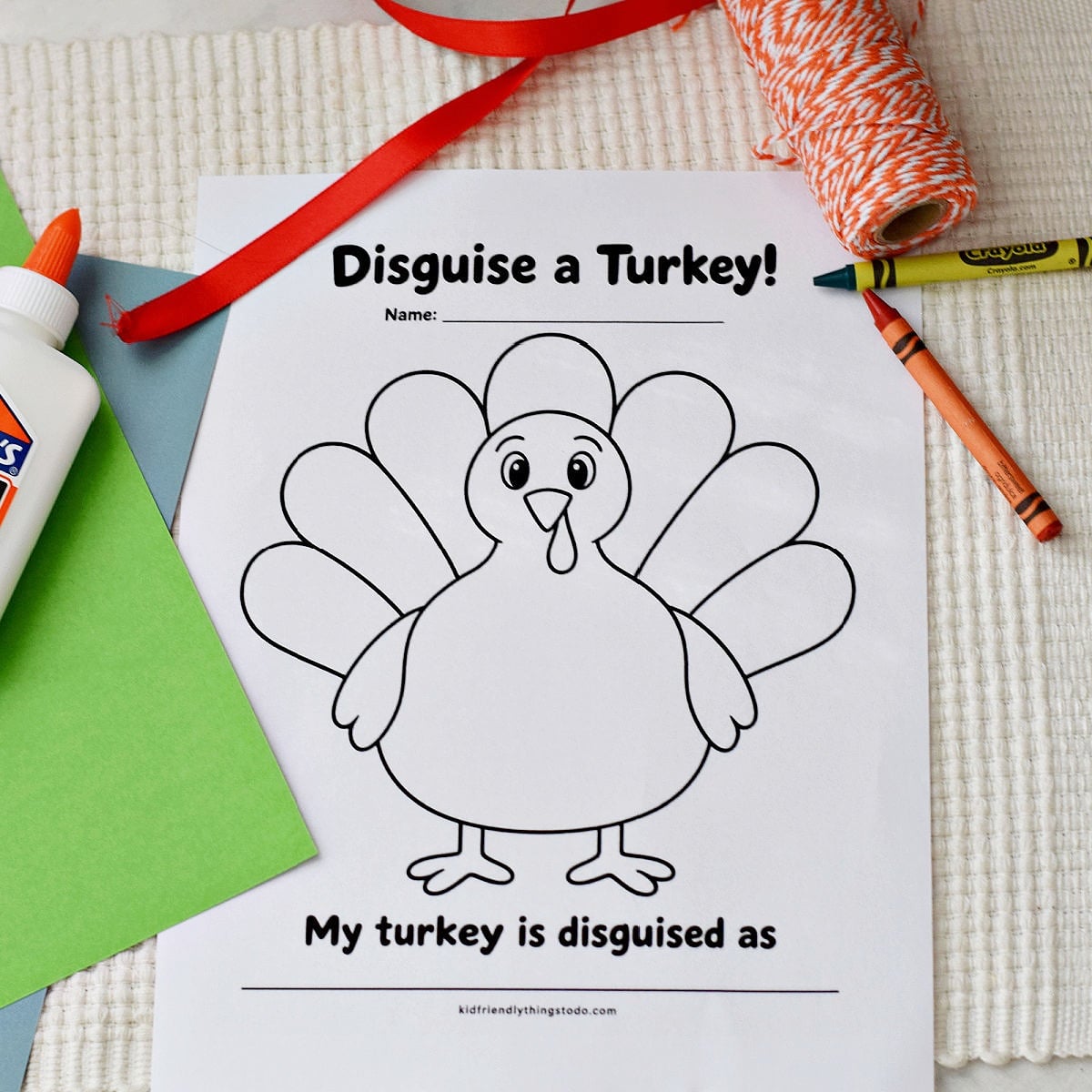 Turkey in disguise printable with a blank turkey outline and crayons on a cream mat.