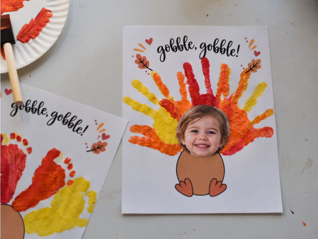 Handprint turkey keepsake with child's photo and colorful painted handprint feathers